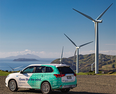 Meridian car in front of a wind farm