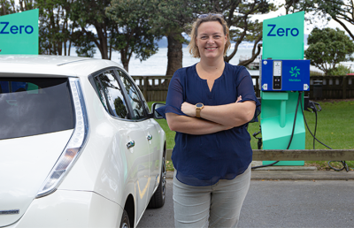 A person with a Nissan Leaf at Zero charging station
