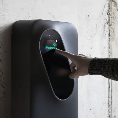 A person using Meridian EV charging Socket