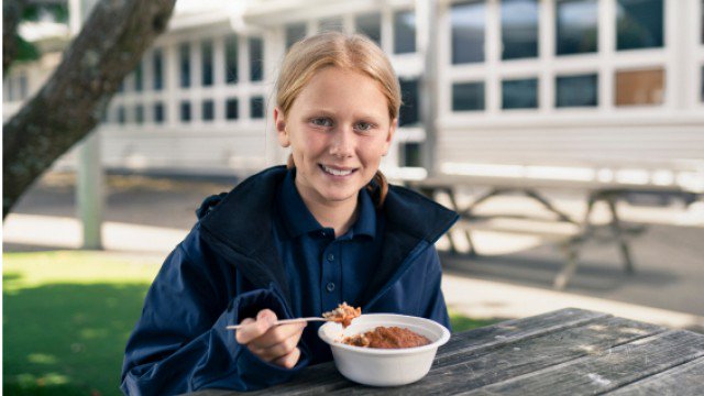 KidsCan child eating breakfast