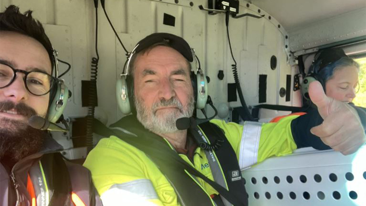 Meridian engineers in a helicopter